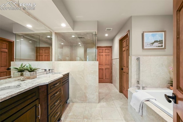 1282 Hill Cir, Colorado Springs, CO 80904 - full bathroom with a shower stall, a bath, double vanity, recessed lighting, and tile walls