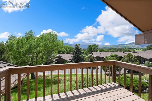 1282 Hill Cir, Colorado Springs, CO 80904 - wooden deck featuring a mountain view and a residential view