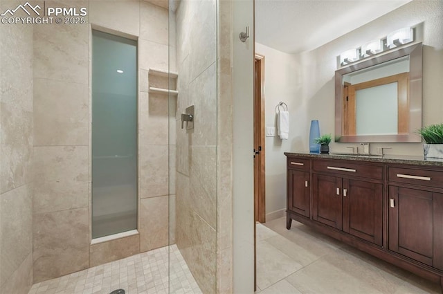 1282 Hill Cir, Colorado Springs, CO 80904 - full bath with tile patterned floors, walk in shower, and vanity