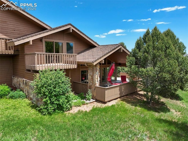 1282 Hill Cir, Colorado Springs, CO 80904 - back of property with a lawn and a deck