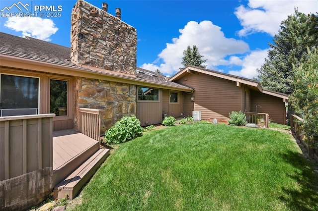 1282 Hill Cir, Colorado Springs, CO 80904 - view of grassy yard with a deck