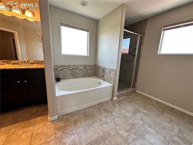 9767 Carnival Ln, Fountain, CO 80817 - full bathroom featuring a jetted tub, vanity, and a stall shower