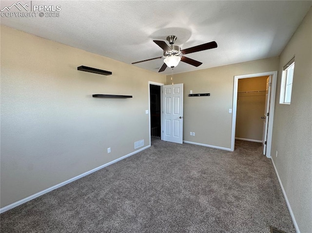 9767 Carnival Ln, Fountain, CO 80817 - unfurnished bedroom featuring a walk in closet, carpet floors, a ceiling fan, and a closet