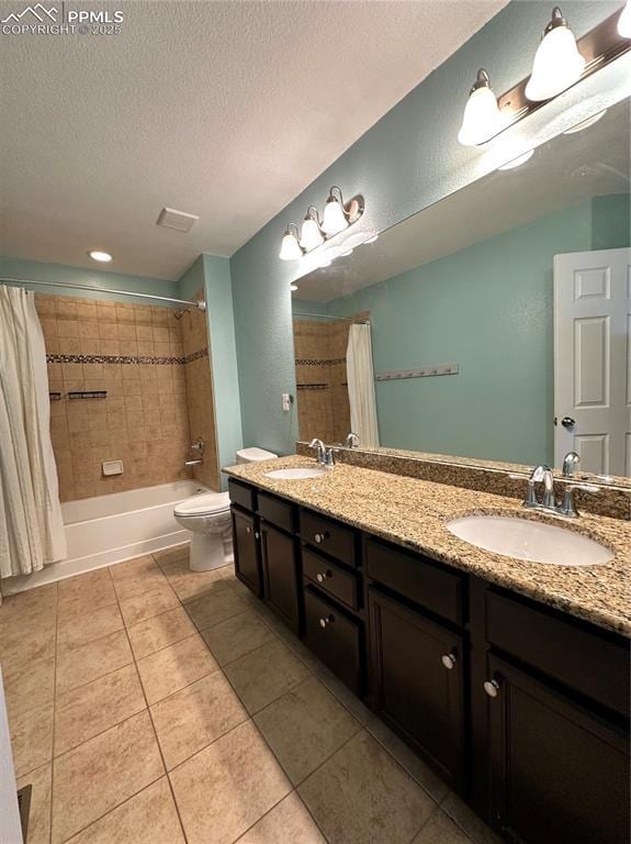 9767 Carnival Ln, Fountain, CO 80817 - bathroom with a textured ceiling, double vanity, shower / tub combo with curtain, and tile patterned floors