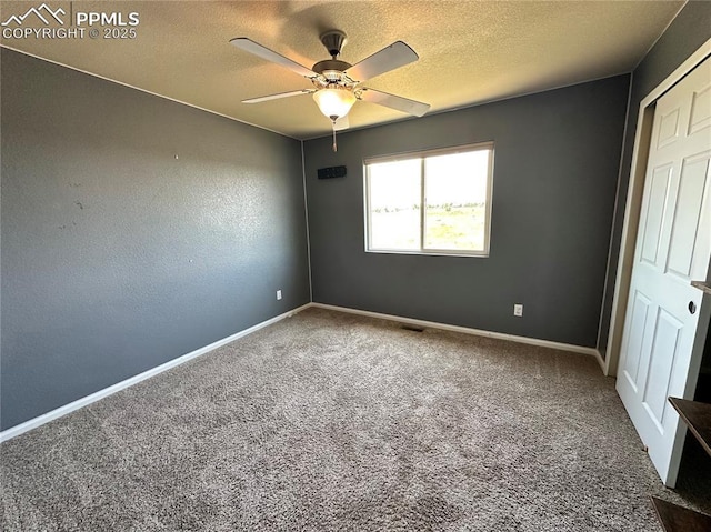 9767 Carnival Ln, Fountain, CO 80817 - carpeted spare room with ceiling fan and a textured ceiling