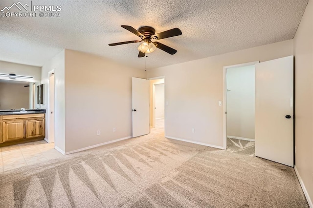 7025 Nettlewood Pl, Colorado Springs, CO 80918 - unfurnished bedroom with light carpet, a textured ceiling, connected bathroom, and ceiling fan
