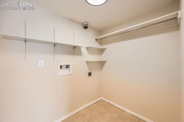 7025 Nettlewood Pl, Colorado Springs, CO 80918 - washroom featuring washer hookup, light tile patterned floors, and electric dryer hookup