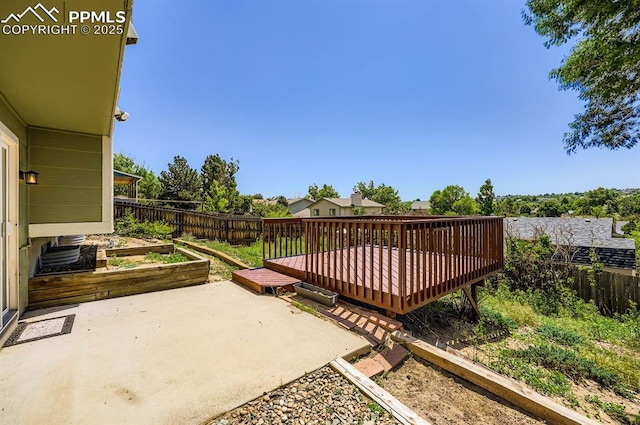 7025 Nettlewood Pl, Colorado Springs, CO 80918 - fenced backyard featuring a patio and a deck