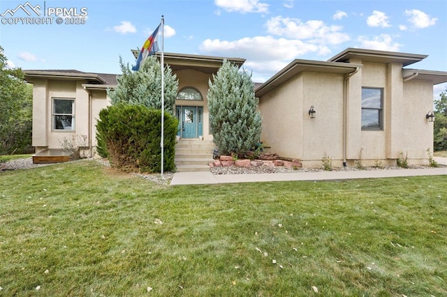 10 Desert Inn Way, Colorado Springs, CO 80921 - view of front of house featuring stucco siding and a front lawn