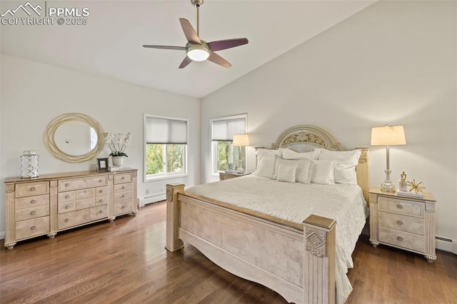 10 Desert Inn Way, Colorado Springs, CO 80921 - bedroom with vaulted ceiling, dark wood finished floors, a ceiling fan, and a baseboard heating unit