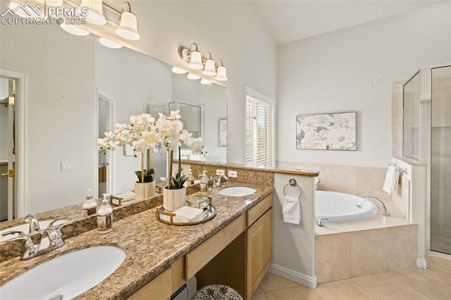 10 Desert Inn Way, Colorado Springs, CO 80921 - full bathroom featuring a shower stall, a garden tub, double vanity, tile patterned floors, and lofted ceiling