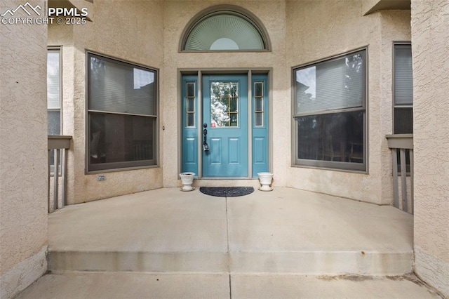 10 Desert Inn Way, Colorado Springs, CO 80921 - doorway to property with stucco siding