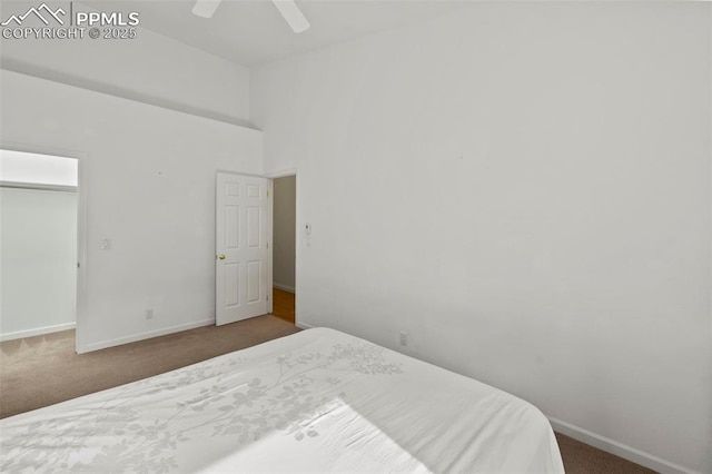 10 Desert Inn Way, Colorado Springs, CO 80921 - bedroom with carpet, a ceiling fan, a towering ceiling, and a closet