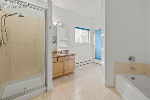10 Desert Inn Way, Colorado Springs, CO 80921 - full bath featuring baseboard heating, a shower stall, tile patterned flooring, vanity, and a garden tub