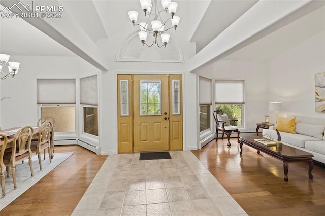 10 Desert Inn Way, Colorado Springs, CO 80921 - foyer featuring a chandelier, vaulted ceiling, and wood finished floors