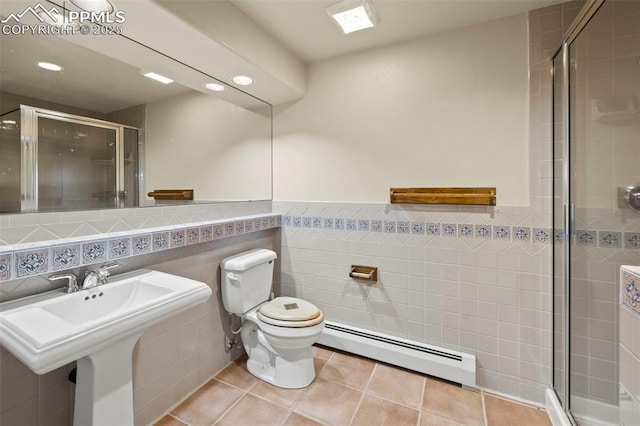 10 Desert Inn Way, Colorado Springs, CO 80921 - full bathroom featuring a baseboard heating unit, tile walls, a shower stall, recessed lighting, and tile patterned floors