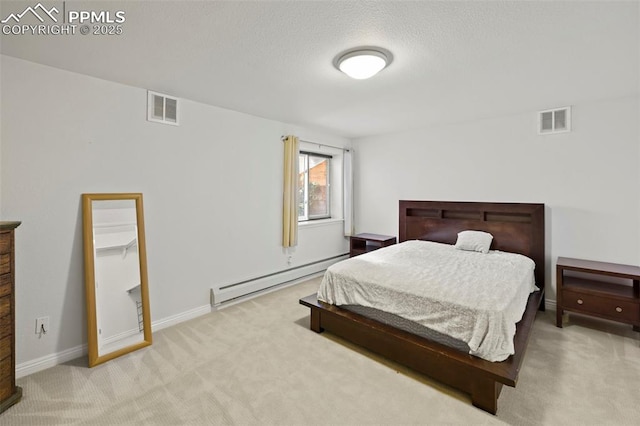 10 Desert Inn Way, Colorado Springs, CO 80921 - bedroom with baseboard heating, carpet, and a textured ceiling