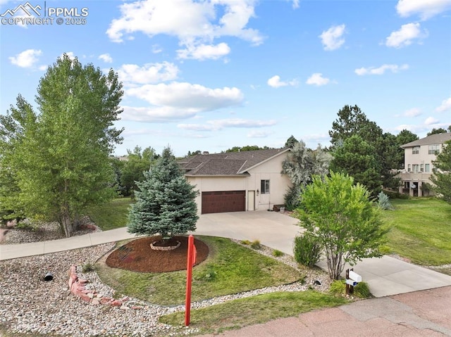 10 Desert Inn Way, Colorado Springs, CO 80921 - view of front of house featuring concrete driveway, an attached garage, stucco siding, and a front yard