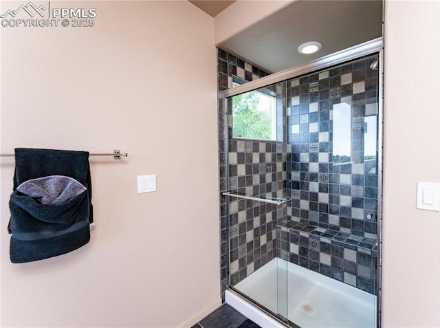616 Tierra Verde Ct, Colorado Springs, CO 80904 - bathroom with a stall shower and baseboards