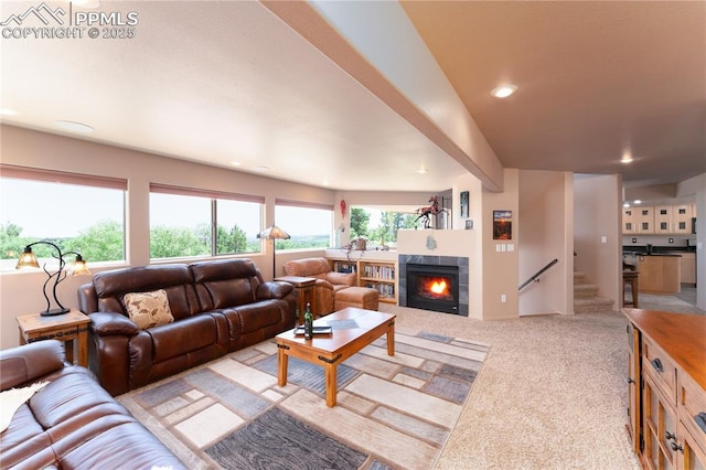 616 Tierra Verde Ct, Colorado Springs, CO 80904 - living area with a tile fireplace, light colored carpet, stairway, and recessed lighting