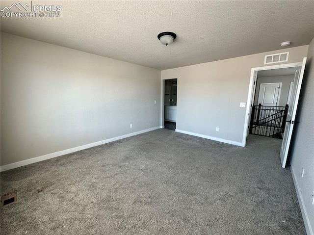 11489 Piping Plover Pl, Colorado Springs, CO 80925 - carpeted empty room with baseboards and a textured ceiling