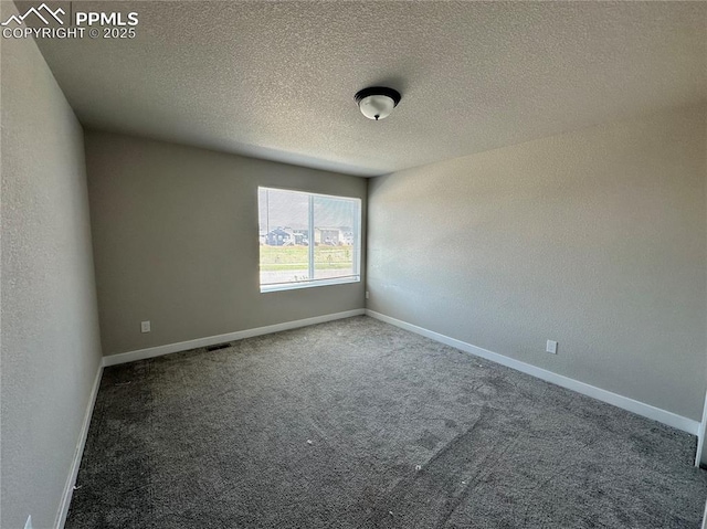 11489 Piping Plover Pl, Colorado Springs, CO 80925 - carpeted spare room featuring baseboards and a textured ceiling