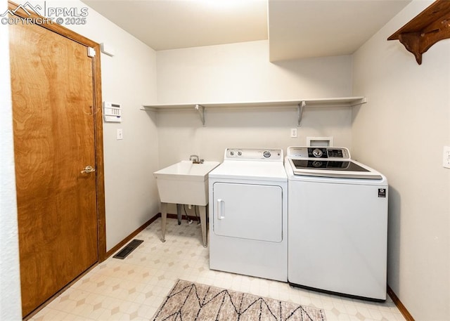 2457 Craycroft Dr, Colorado Springs, CO 80920 - laundry area featuring independent washer and dryer and light floors