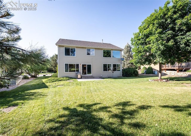 2457 Craycroft Dr, Colorado Springs, CO 80920 - back of house featuring a yard and a patio area