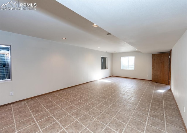 2457 Craycroft Dr, Colorado Springs, CO 80920 - spare room with recessed lighting and light tile patterned floors
