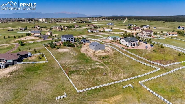 12275 Oregon Wagon Trl, Elbert, CO 80106 - aerial view of property and surrounding area featuring mountains and rural landscape