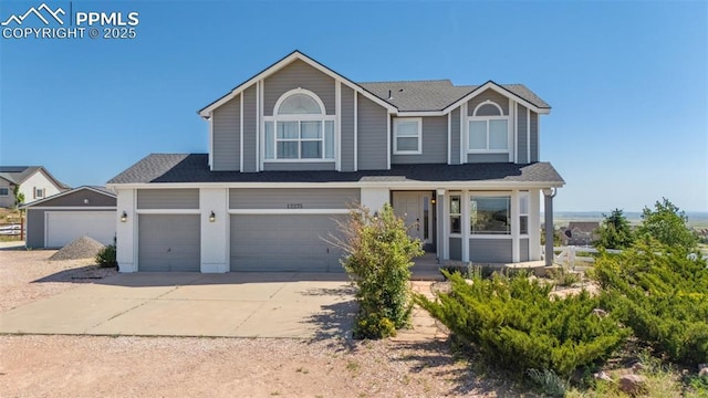 12275 Oregon Wagon Trl, Elbert, CO 80106 - view of front of property featuring concrete driveway, a garage, and a shingled roof