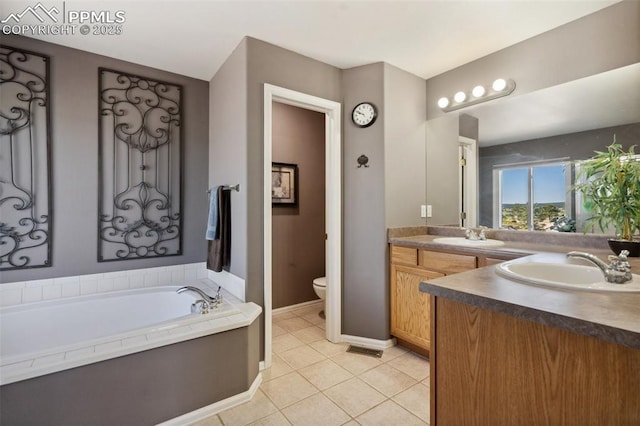 12275 Oregon Wagon Trl, Elbert, CO 80106 - full bathroom with vanity, a garden tub, and tile patterned floors