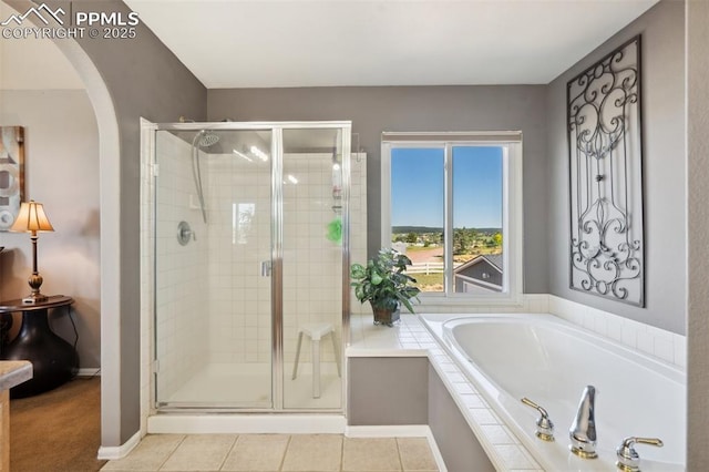 12275 Oregon Wagon Trl, Elbert, CO 80106 - bathroom featuring a garden tub, a stall shower, and tile patterned flooring