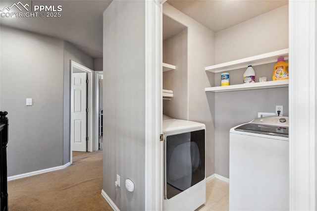 12275 Oregon Wagon Trl, Elbert, CO 80106 - laundry room featuring washer and dryer and light carpet