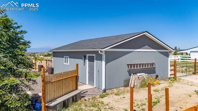 12275 Oregon Wagon Trl, Elbert, CO 80106 - view of front facade with an outbuilding and roof with shingles
