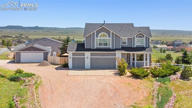 12275 Oregon Wagon Trl, Elbert, CO 80106 - traditional-style home featuring concrete driveway, roof with shingles, and an attached garage