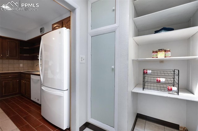1112 W 4th St, Florence, CO 81226 - kitchen with white appliances, open shelves, decorative backsplash, and light countertops