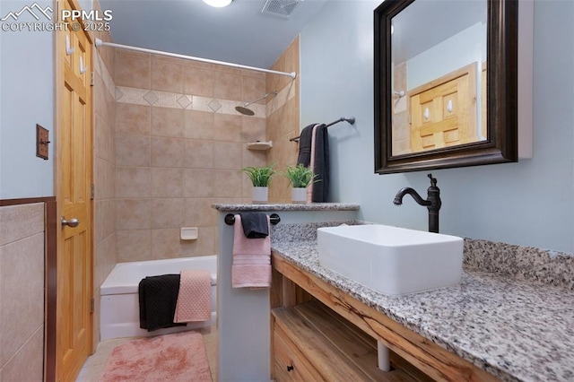 1112 W 4th St, Florence, CO 81226 - full bath with shower / bathtub combination, tile patterned floors, and vanity