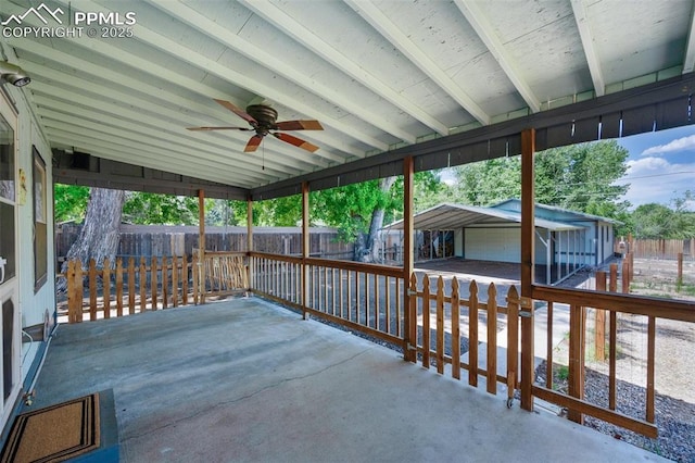 1112 W 4th St, Florence, CO 81226 - fenced backyard featuring ceiling fan, a garage, an outdoor structure, and a patio