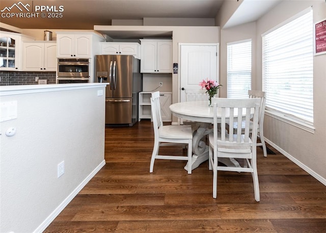 7145 Appletree Loop, Colorado Springs, CO 80925 - dining room with dark wood finished floors and baseboards