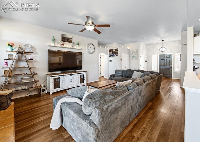 7145 Appletree Loop, Colorado Springs, CO 80925 - living area featuring ceiling fan, wood finished floors, and arched walkways