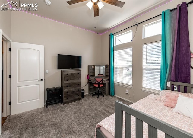 7145 Appletree Loop, Colorado Springs, CO 80925 - bedroom featuring carpet, multiple windows, a desk, and a ceiling fan