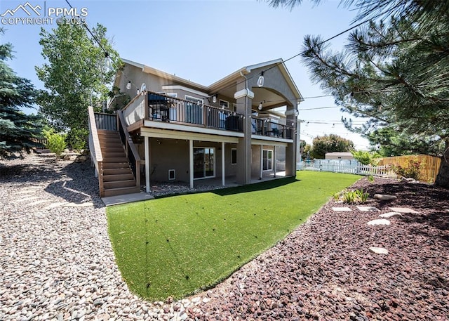 7145 Appletree Loop, Colorado Springs, CO 80925 - back of house with stairs, stucco siding, a deck, and a patio