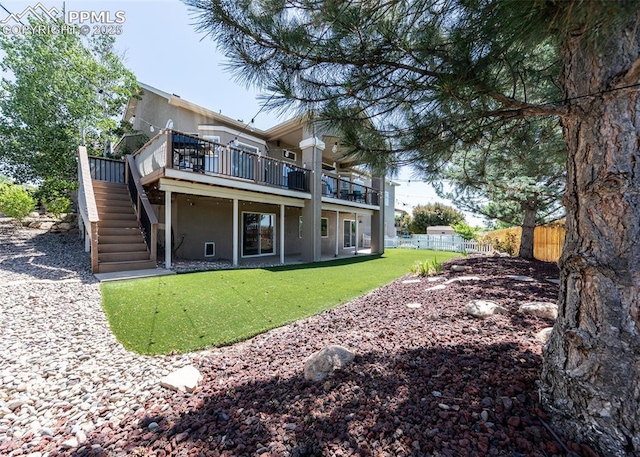 7145 Appletree Loop, Colorado Springs, CO 80925 - back of house featuring stairway, a deck, and stucco siding