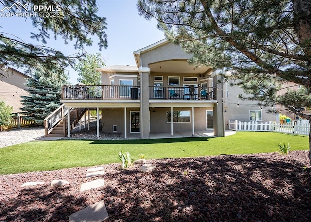 7145 Appletree Loop, Colorado Springs, CO 80925 - back of property with stucco siding, a patio, stairs, and a deck