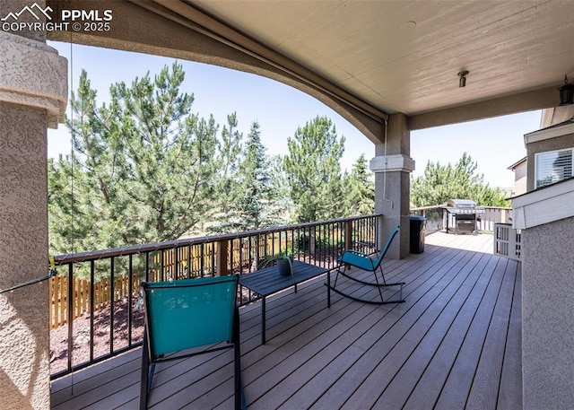 7145 Appletree Loop, Colorado Springs, CO 80925 - wooden deck with a grill