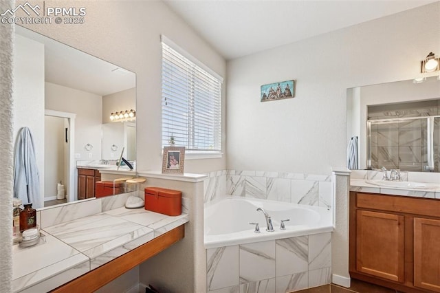 6107 Adamants Dr, Colorado Springs, CO 80924 - full bath featuring a garden tub, two vanities, and a shower stall