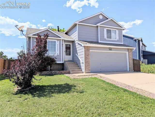 2132 Reminiscent Cir, Fountain, CO 80817 - view of front facade featuring a garage, driveway, roof with shingles, and brick siding