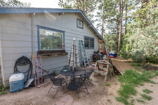 12185 Black Forest Rd, Colorado Springs, CO 80908 - rear view of house featuring a patio