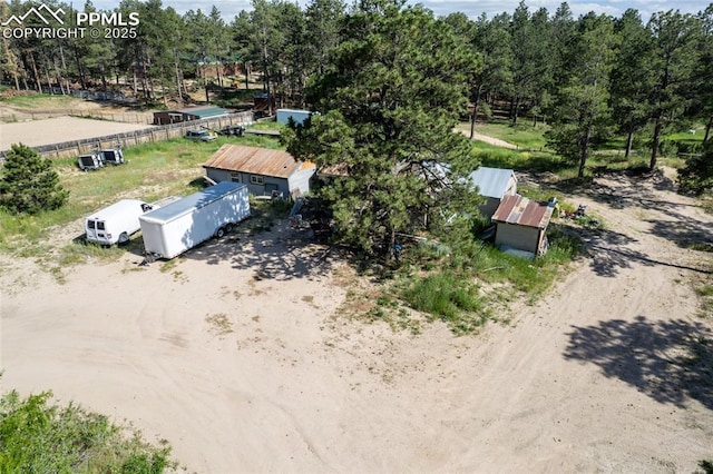 12185 Black Forest Rd, Colorado Springs, CO 80908 - view of subject property featuring a tree filled landscape